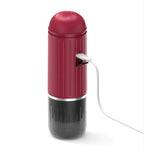 Red and black cylindrical device with a USB cable on a white background