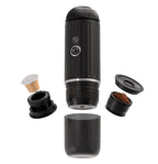 Black portable coffee maker with components on a white background