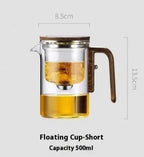 Glass teapot with wooden handle and lid, filled with tea, on a white background with measurements.