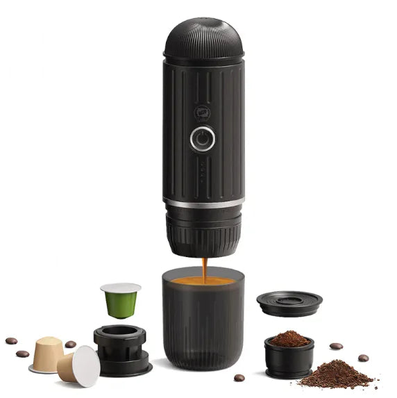 Black portable espresso machine with accessories on a white background